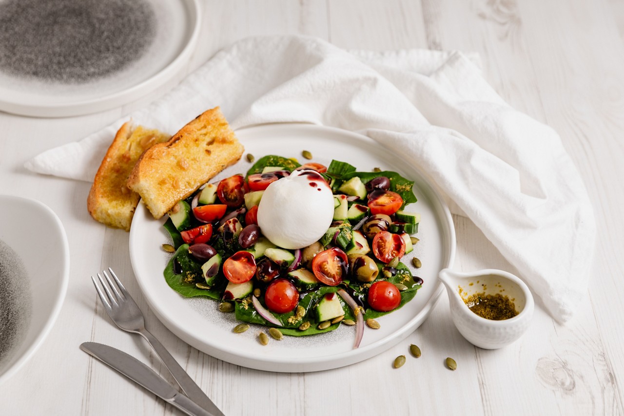 Salad topped with burrata.